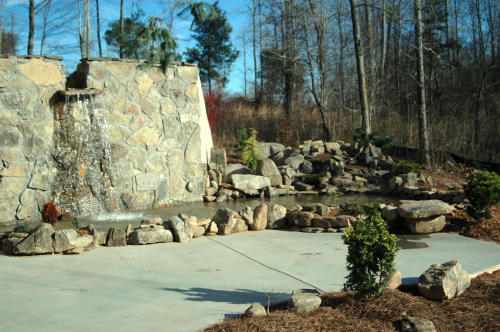 A large rock was placed to create a dramatic waterfall